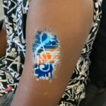 Stylized Treble Clef Airbrush Tattoo. Airbrush tattoo and face painting gallery. Airbrush Tattoos in Winnipeg and NW Ontario.